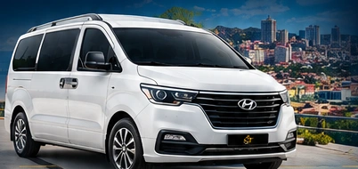 White Hyundai Grand Starex minivan